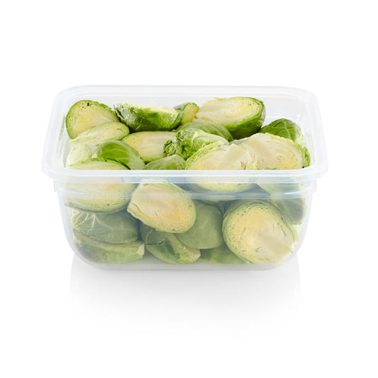 Container of green brussels sprouts on a white background