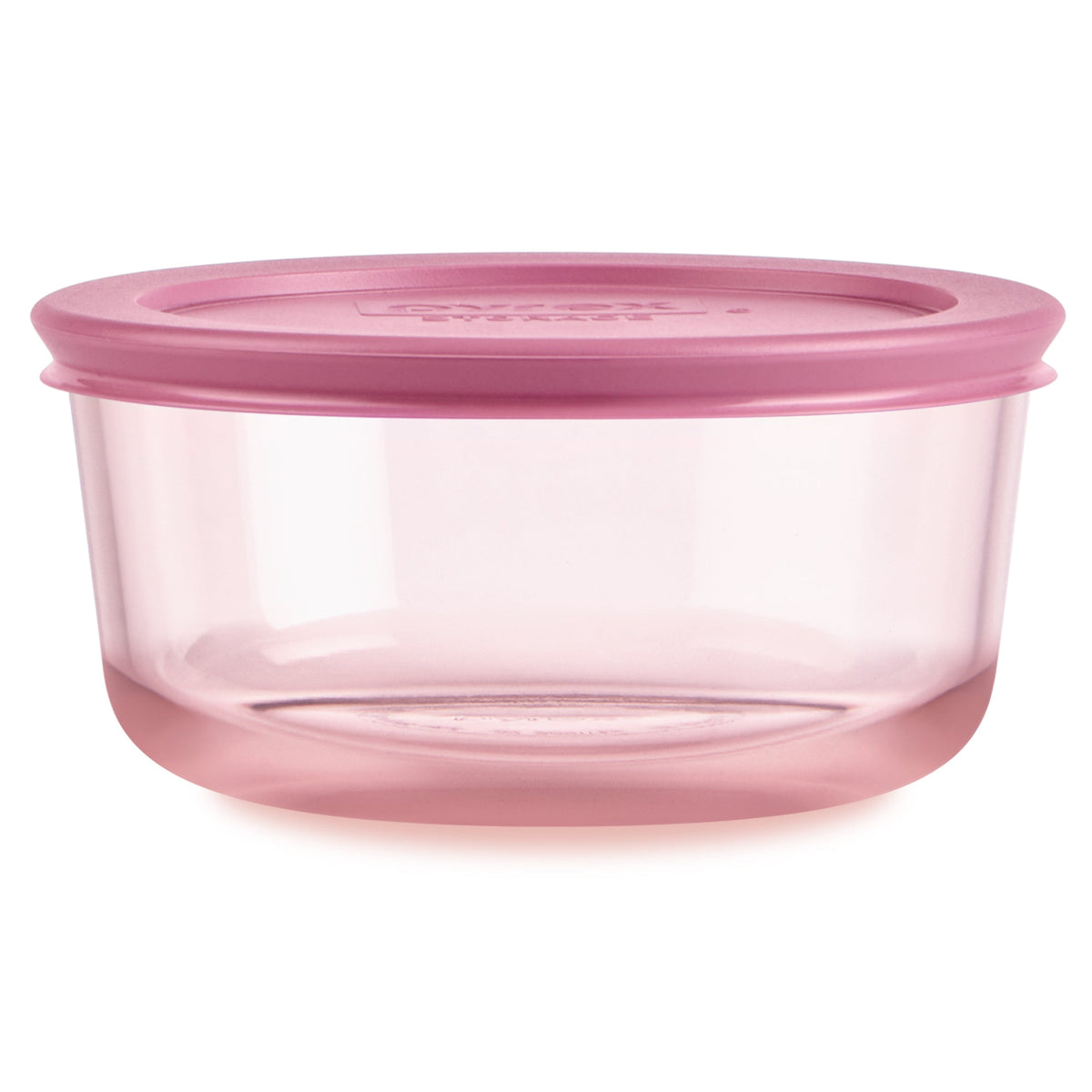 Pink food storage container with lid on a white background