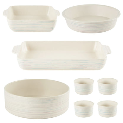Set of ceramic cookware including bowls, casseroles, and cups on a white background