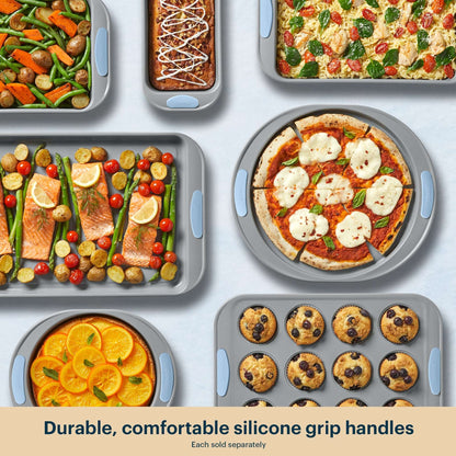 Collection of baked dishes with durable silicone grip handles on a light gray background.