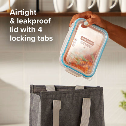Kleanware container with airtight lid held over a tote bag in a kitchen setting
